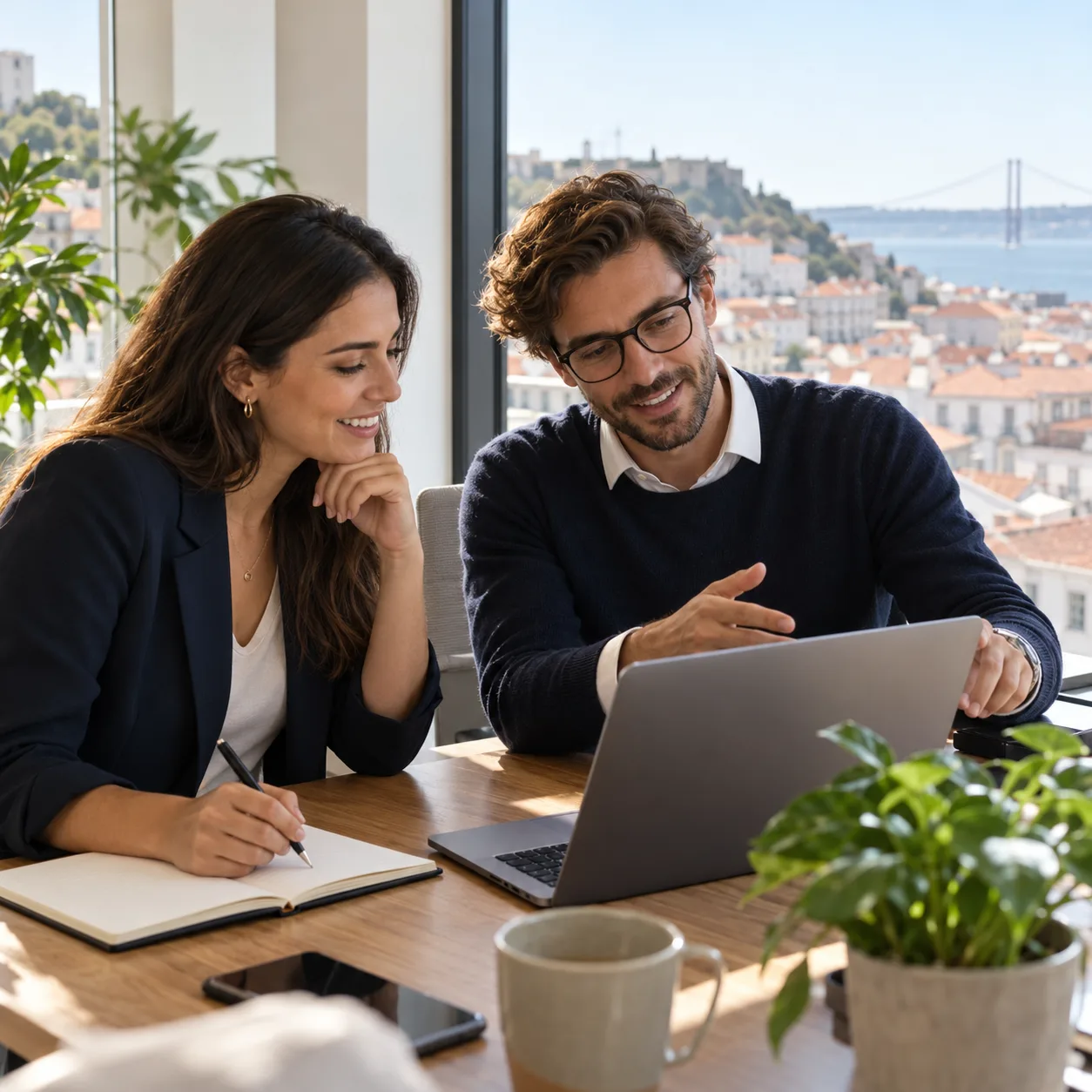 Two professionals discussing a hiring plan in an office in Lisbon