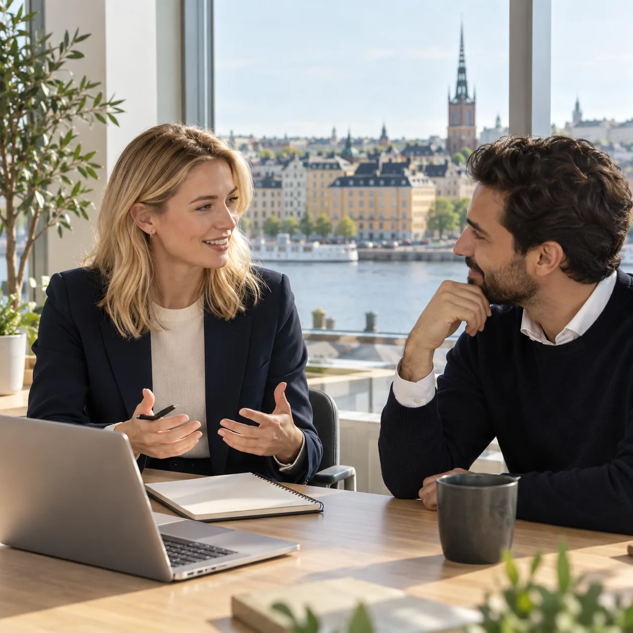 Two professionals discussing a hiring plan in an office in Stockholm